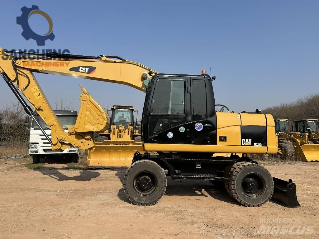 CAT M 320 D2 ホイール式油圧ショベル（パワーショベル・ユンボ・バックホー）