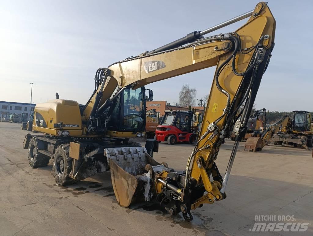 CAT M 313 D ホイール式油圧ショベル（パワーショベル・ユンボ・バックホー）