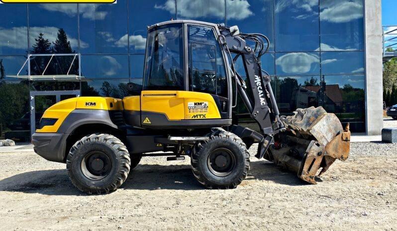 Mecalac 12 M TX バックホーローダー