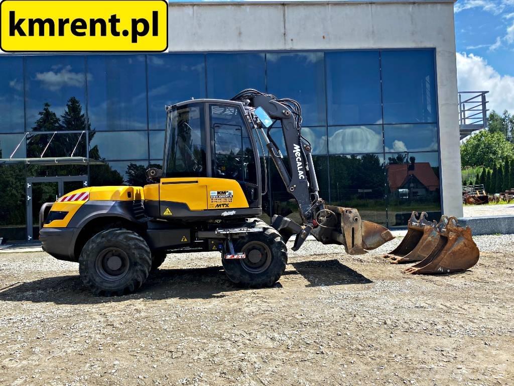 Mecalac 12 M TX バックホーローダー
