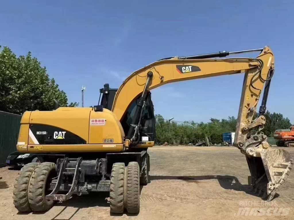 CAT M 315 D ホイール式油圧ショベル（パワーショベル・ユンボ・バックホー）