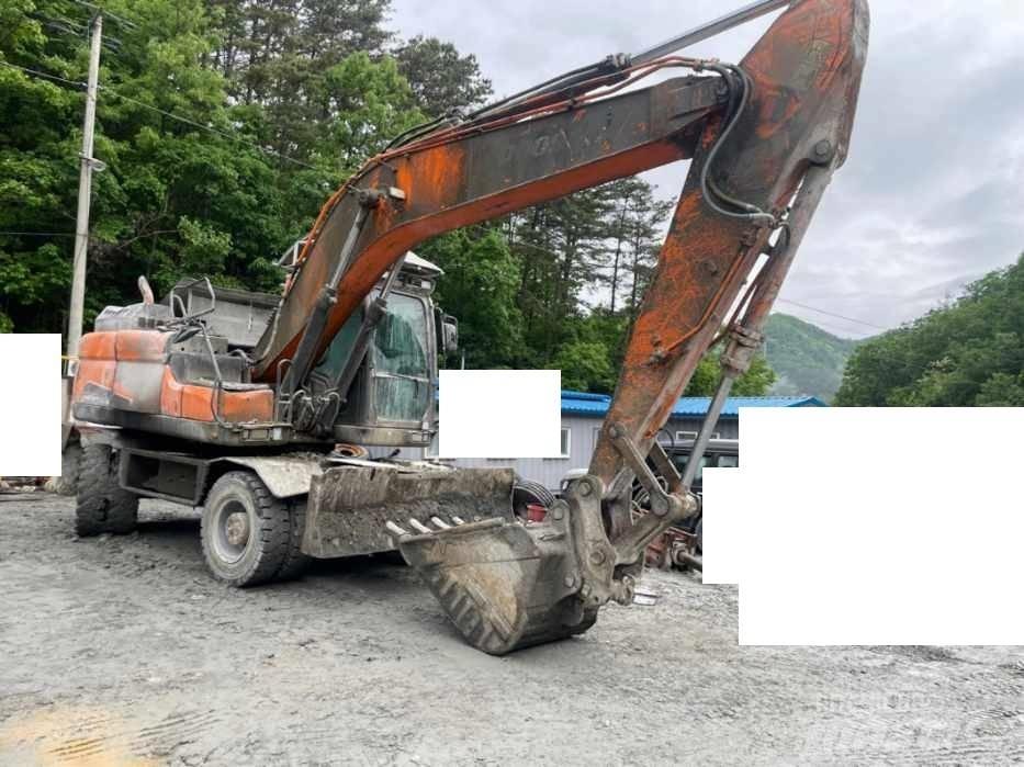 Doosan DX 210 W ホイール式油圧ショベル（パワーショベル・ユンボ・バックホー）
