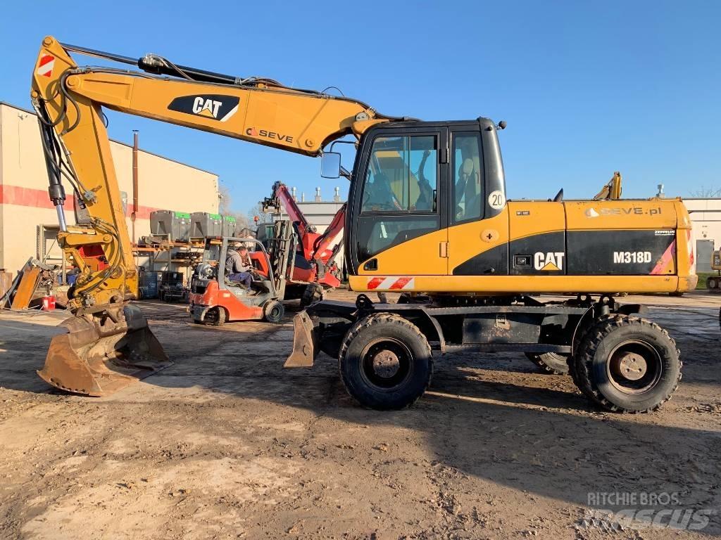 CAT M 318 D ホイール式油圧ショベル（パワーショベル・ユンボ・バックホー）