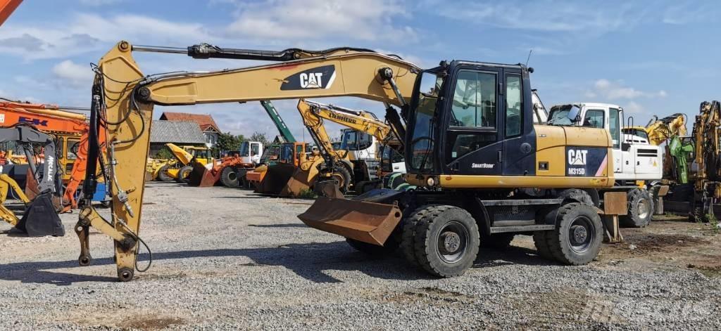 CAT M 315 D ホイール式油圧ショベル（パワーショベル・ユンボ・バックホー）