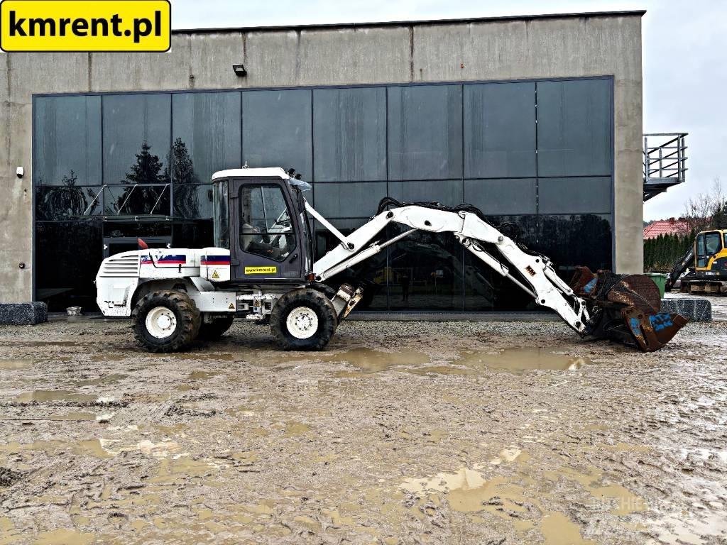 Mecalac 12 M TX バックホーローダー