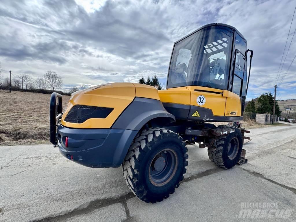 Mecalac 12 M TX バックホーローダー